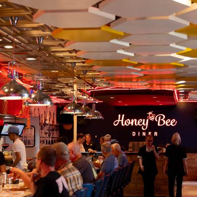 Customers sitting at the bar.