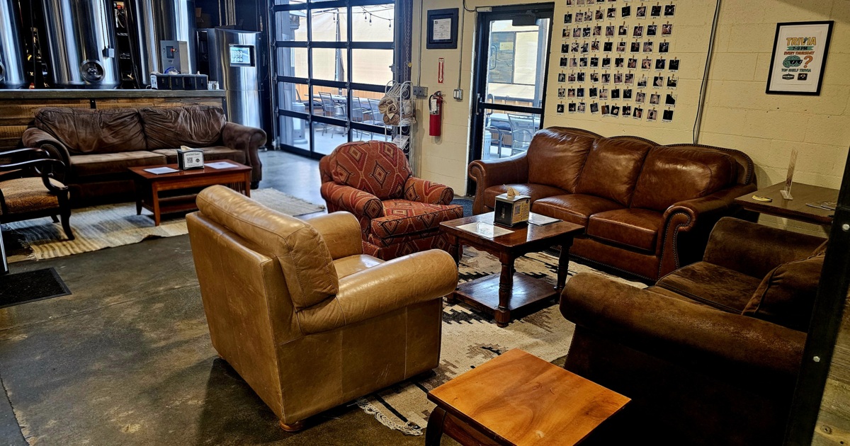 Lounge are with couches, comfy chairs, coffee table and side tables
