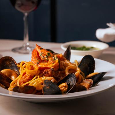 Seafood pasta with mussels, calamari, and shrimp in spicy marinara sauce.