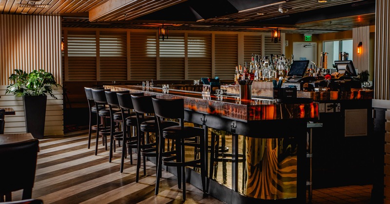 Interior, bar with bar stools, wooden interior details, subtle lighting lanterns