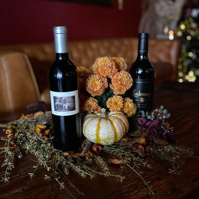 Bottles of wine with a flower arrangement