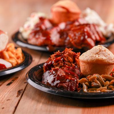 Barbecue plate with pulled pork, green beans, and cornbread