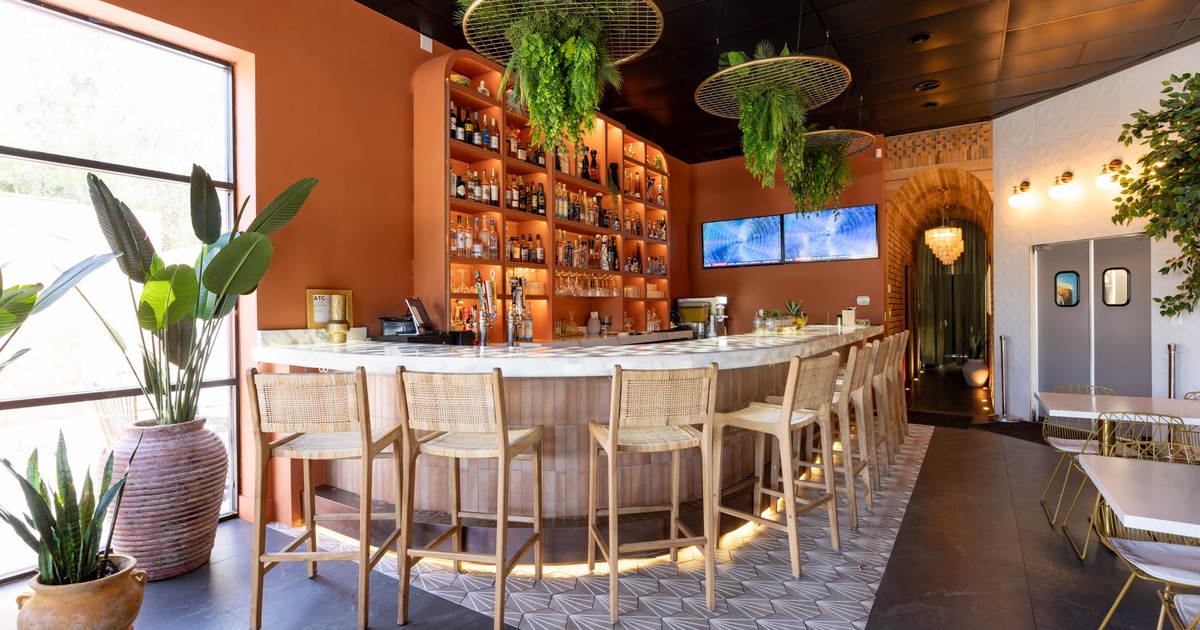 Bar area, neatly lined up bar stools