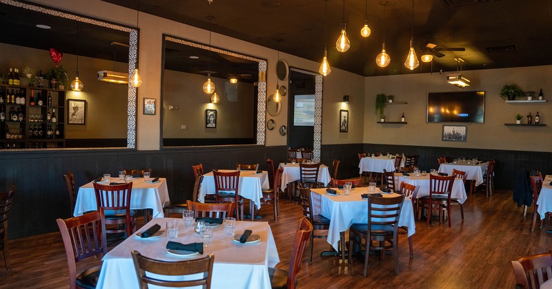 Interior, lined up tables with tableware
