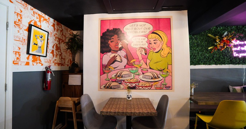 Table for two people, big paining on the wall