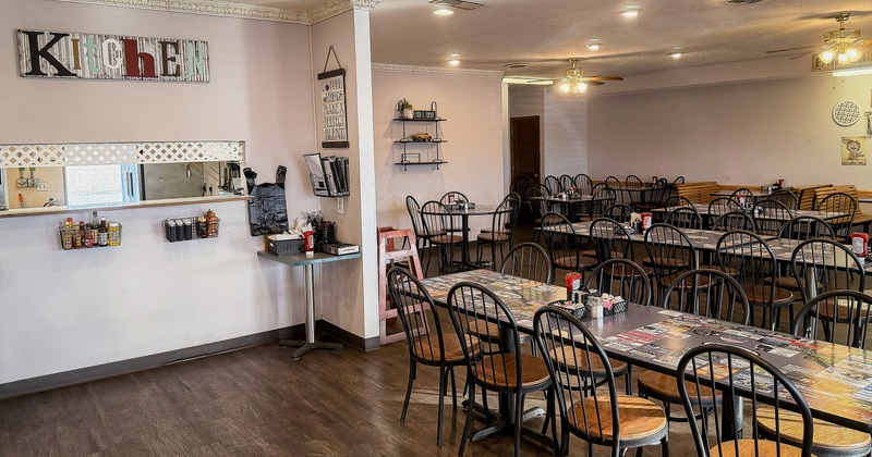 Diner area, tables,chairs, kitchen counter