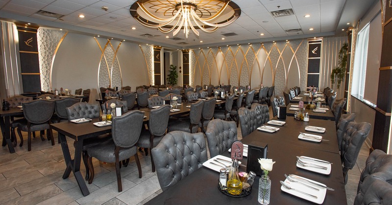 Interior, tables set for guests in dining area