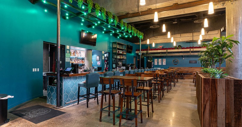 Interior, bar counter area, high seating chairs and tables