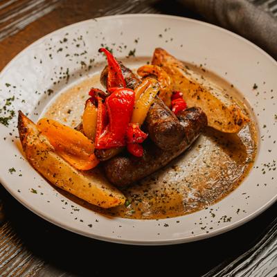 Italian Sausage and Peppers Vesuvio, served.