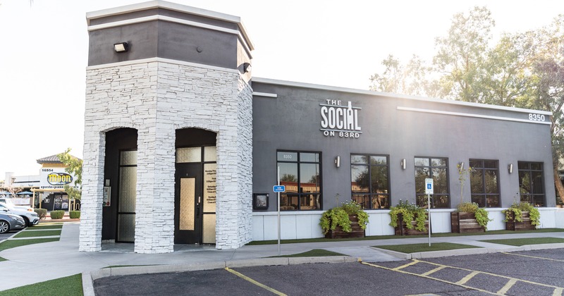 Exterior, front view to restaurant entrance, part of parking lot