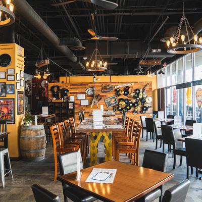 Interior, seating area, walls decorated with rock and roll memorabilia.