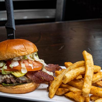 Jalapeno bacon burger with fries.