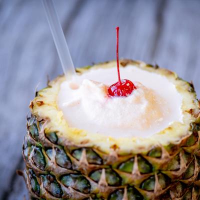 Delicioso frappe served inside a hollowed-out pineapple shell.