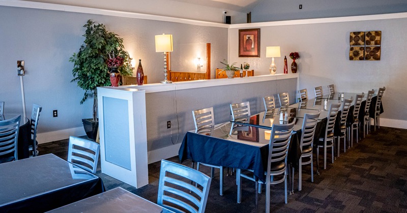 Inside, booth seating area with wall lamp