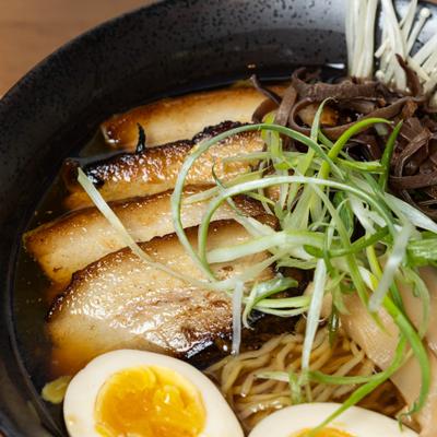 Shoyu ramen with sliced pork, boiled egg, mushrooms and green onions.