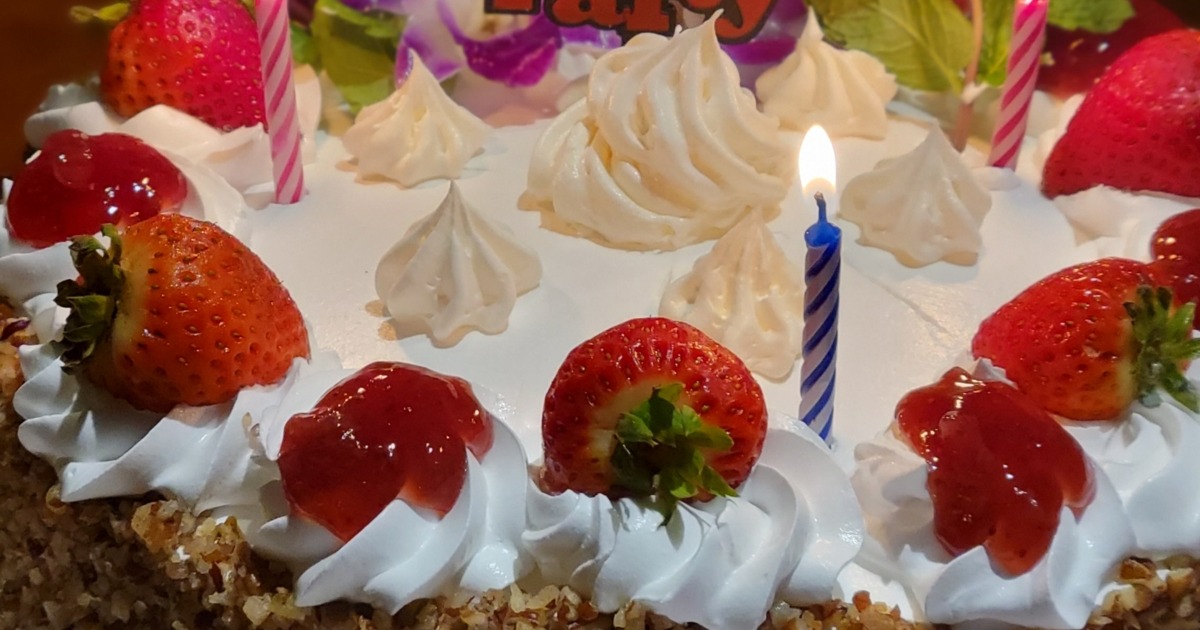 Birthday cake, topped with strawberries