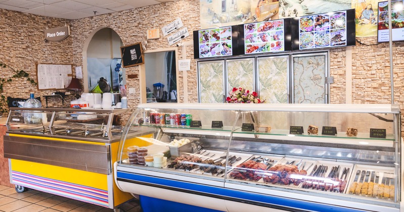 Place order, cold and hot food counter, screens above