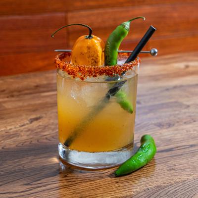 Oaxacan Spicy Margarita, Mezcal, Ancho Reyes, fresh lime, fire roasted habanero and serrano peppers..