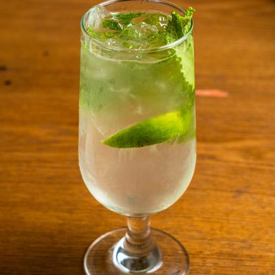 Gin, with lime and lettuce leaves.