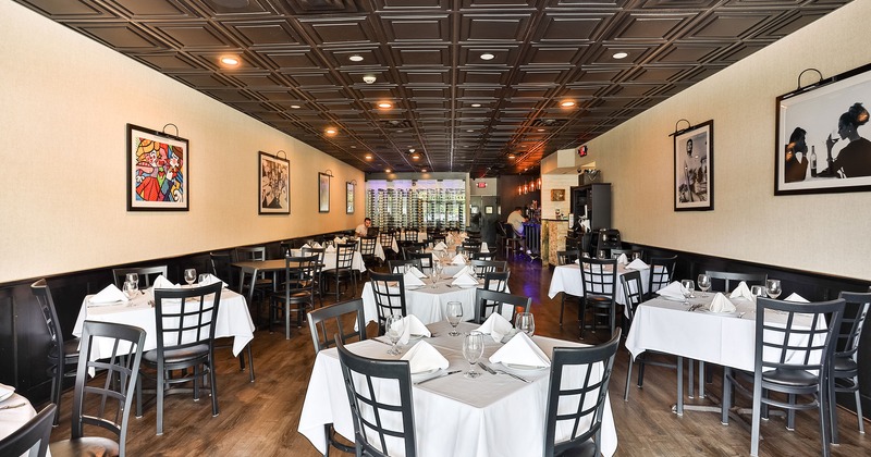 Restaurant interior, dining area with set tables