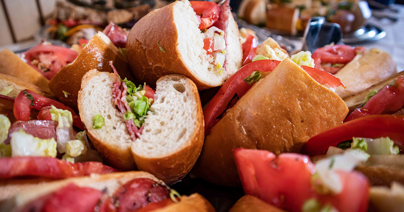 Couple of sandwiches with tomato and  lettuce