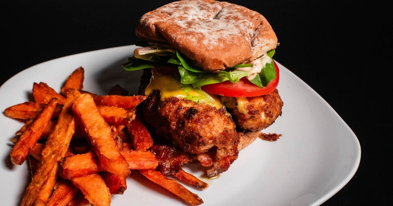 Fried chicken sandwich with fries