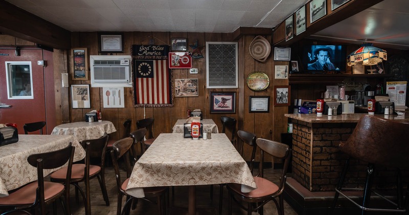 Interior, seating area, tables ready for guests