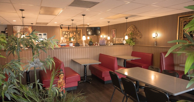 Interior of a restaurant with red booths