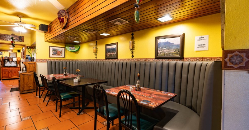 Interior, leather banquette seating with tables and chairs