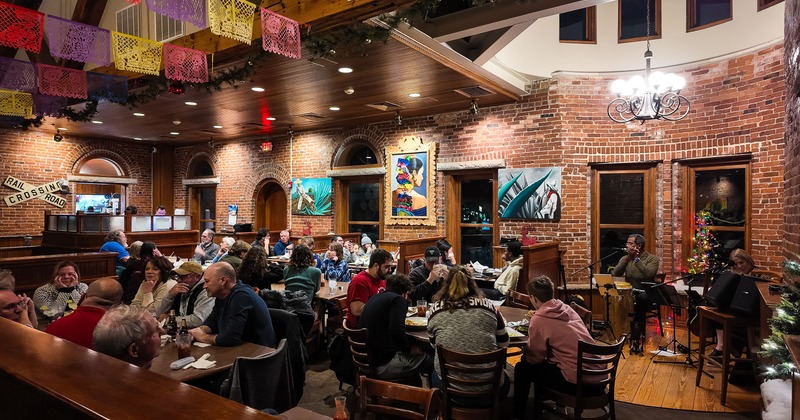 Spacious seating area with guests enjoying their food and drinks