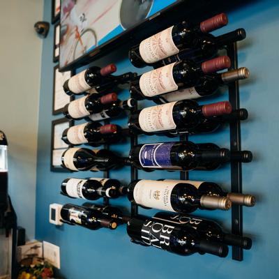 Wines displayed on the wall mounted wine rack