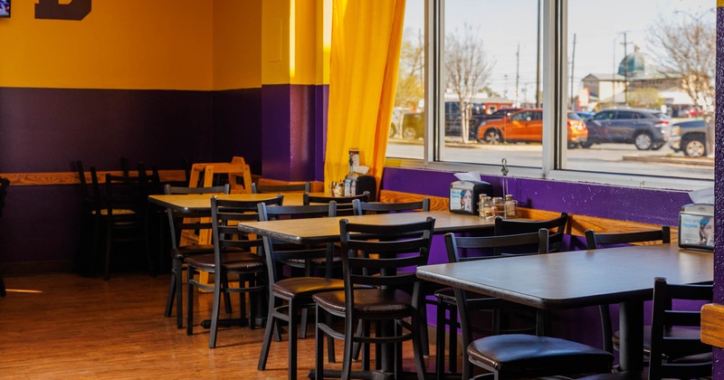 Interior, dining tables by the windows