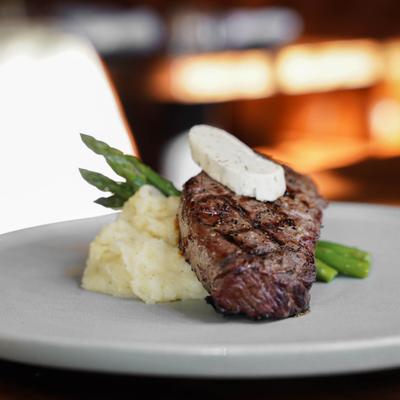Steak with mashed potatoes.