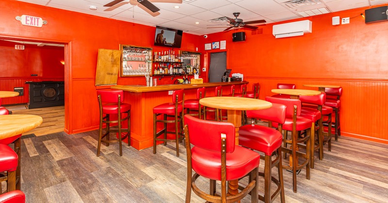 Bar area, tall tables and bar stools