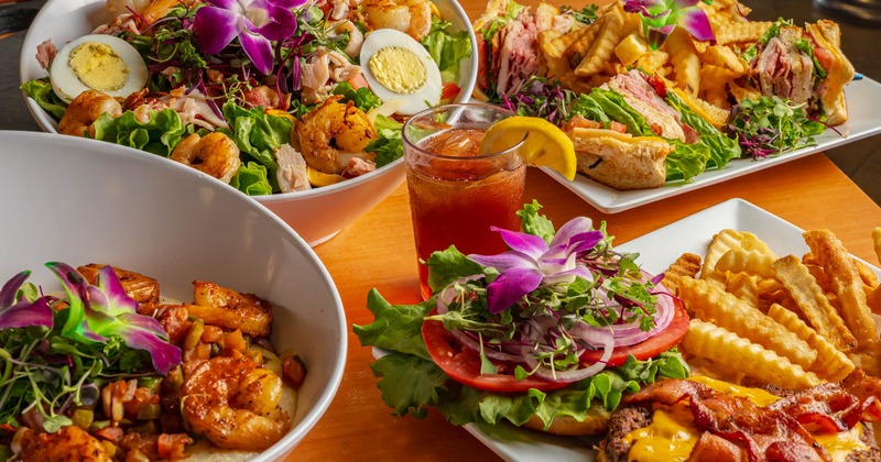 Assortment of restaurant dishes displayed on a wooden table