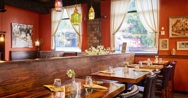 Interior, dining area, wooden banquette bench with tables and chairs