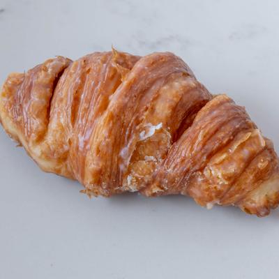 Glazed croissant donut.