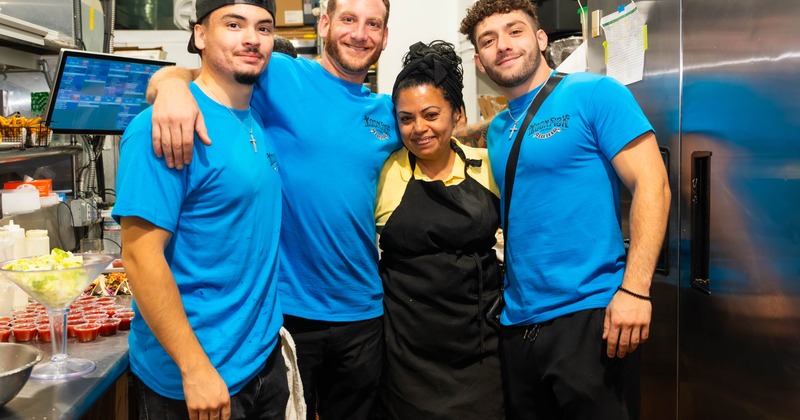 The staff posing for a photo