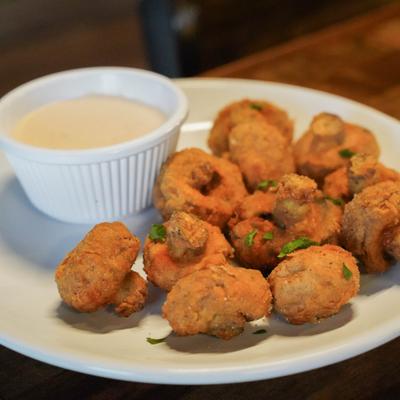 Caddy Caps served with creamy dipping sauce.