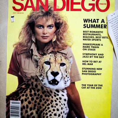 A magazine cover featuring a person and a cheetah