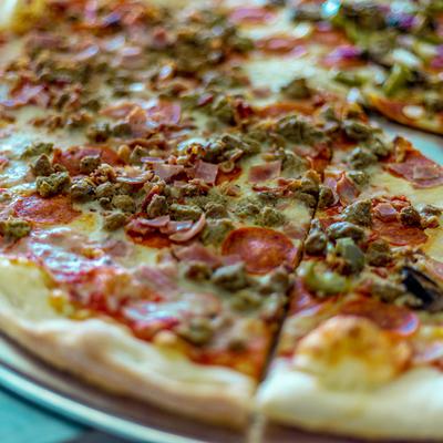 A pizza served, closeup