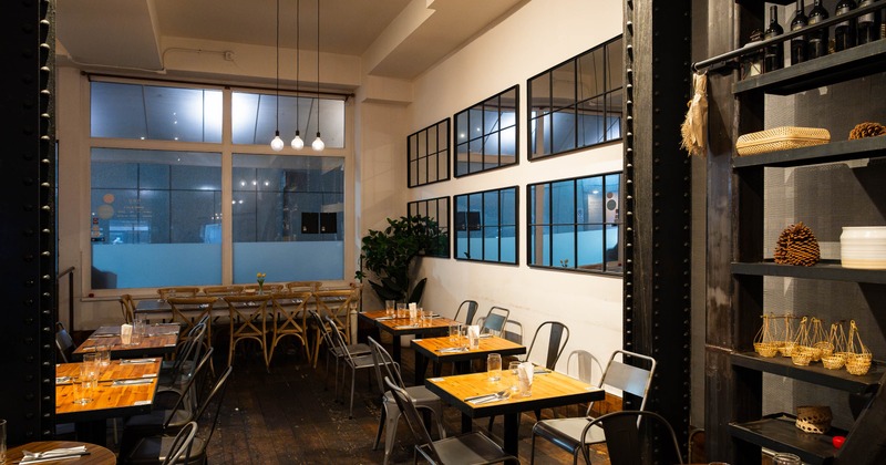 Interior, dining area, wooden top tables with chairs, ready for guests