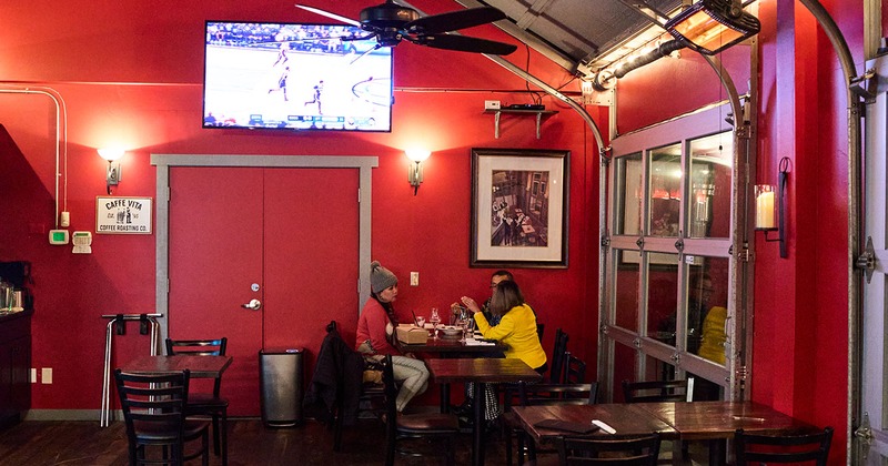 Interior, seating area, three guests enjoying their drinks