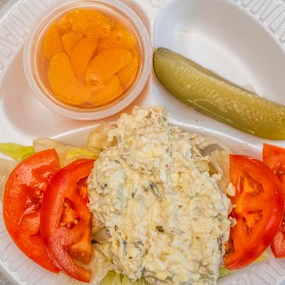 Chicken Salad served with fresh vegetables, pickle spear and fresh fruit.