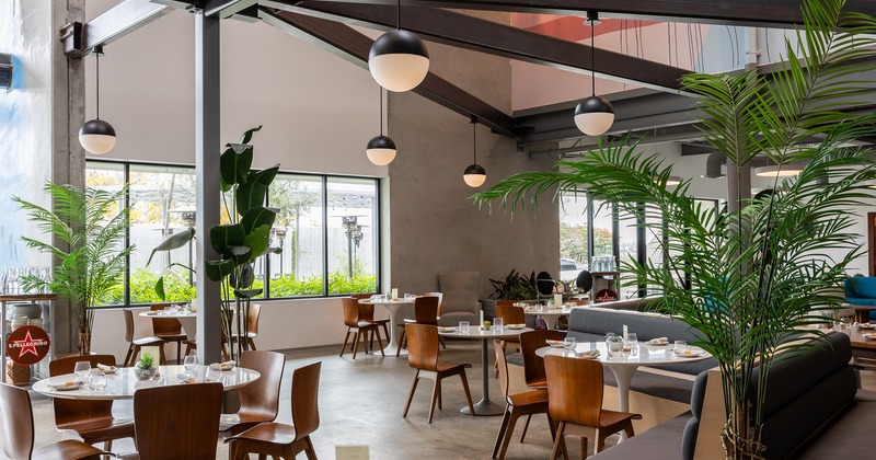 Modern design of the restaurant's dining area with set dining tables