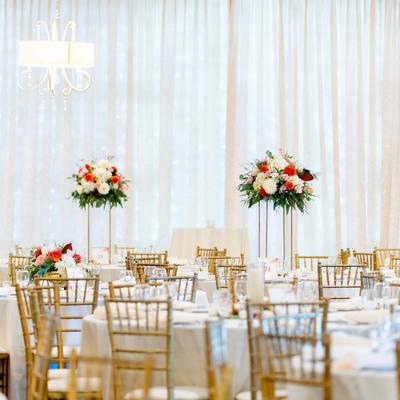 Interior, seating area with tables, chairs and flower decoration