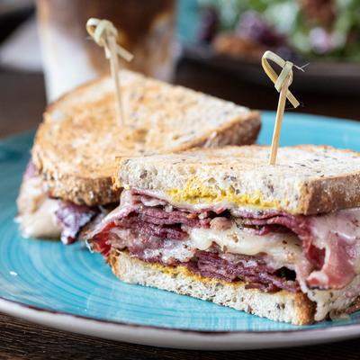 Hot Pastrami sandwich, with Swiss cheese and mustard.