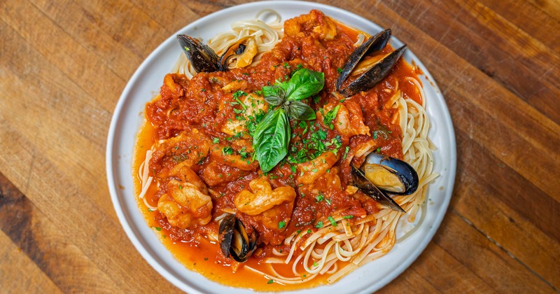 Seafood pasta with mussels, shrimp and basil