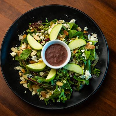 Vesuvio's Salad, with spring mix, almonds, apples, gorgonzola, and raspberry vinaigrette.
