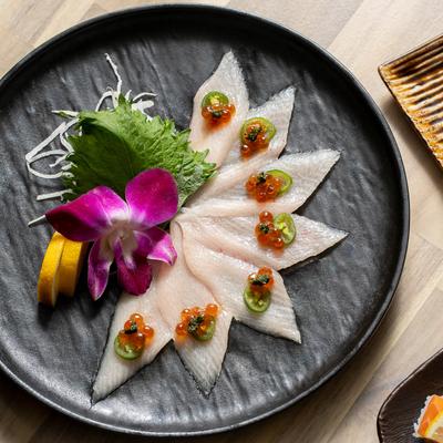 Thinly sliced yellowtail sashimi.